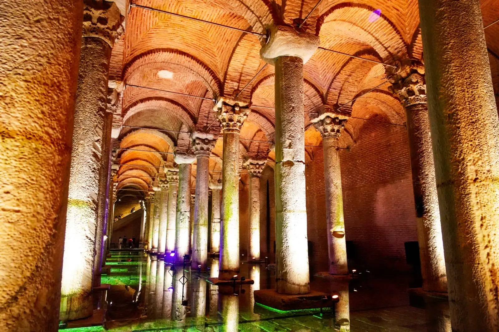 An upward view of the Byzantine brick vaults and the carved capitals that carry them.